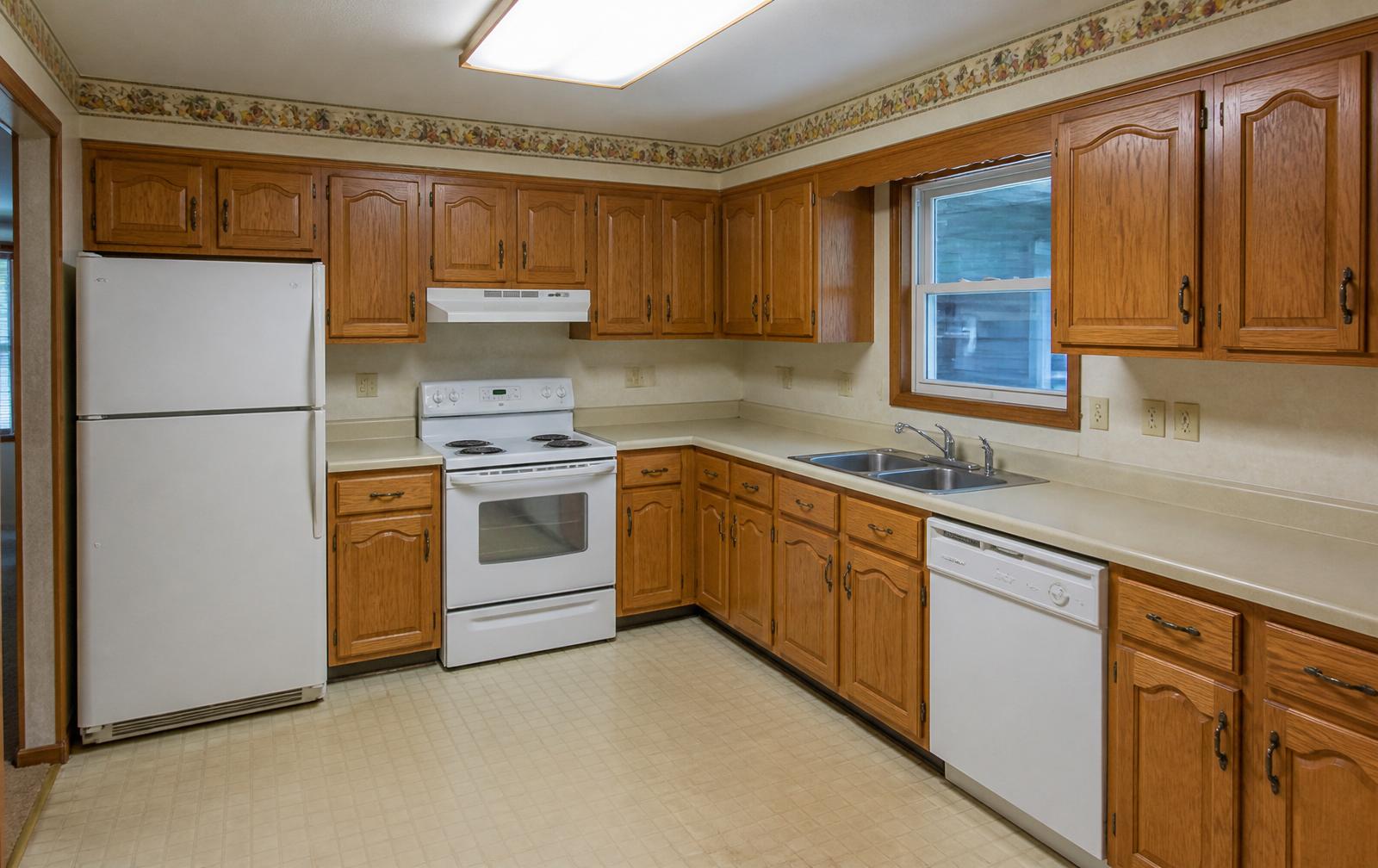 Dated oak kitchen before renovation